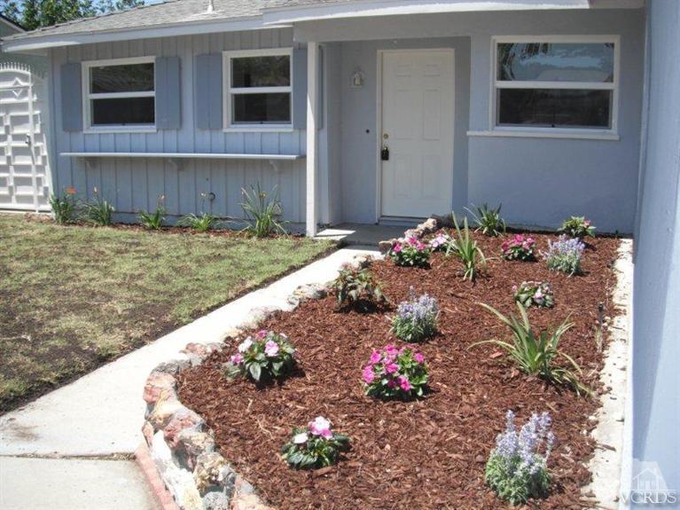 2117 Magnolia Street Simi Valley, CA 93065 - Photo 1 of 16 a front view of a house with a yard