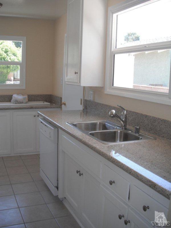 2117 Magnolia Street Simi Valley, CA 93065 - Photo 2 of 16 a kitchen with a sink cabinets and window