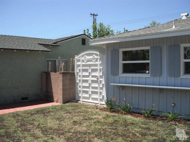 2117 Magnolia Street Simi Valley, CA 93065 - Photo 15 of 16 a front view of a house with a yard