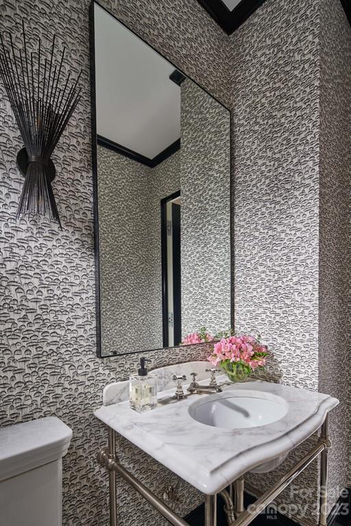 2527 Lemon Tree Lane Charlotte, NC 28211 - Photo 21 of 40 a bathroom with a sink and a mirror