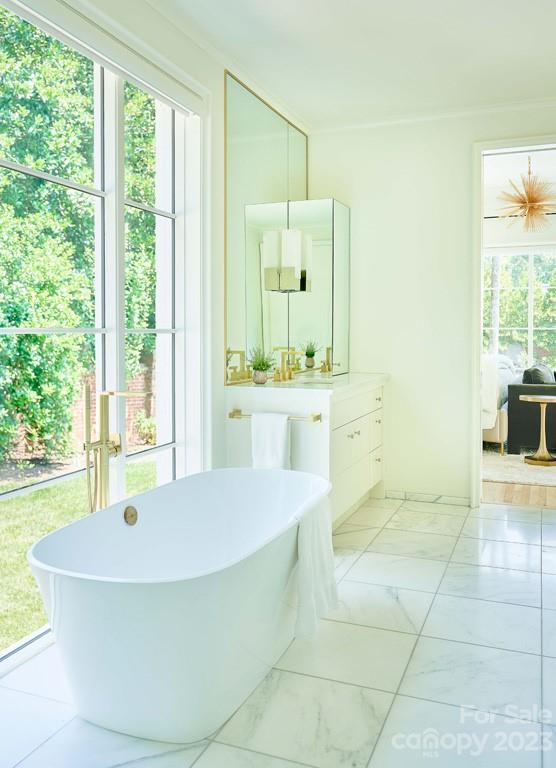 2527 Lemon Tree Lane Charlotte, NC 28211 - Photo 24 of 40 a spacious bathroom with a tub sink and mirror