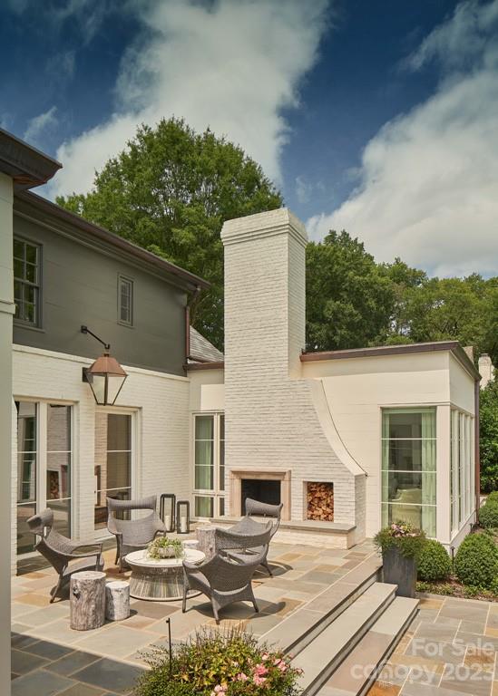 2527 Lemon Tree Lane Charlotte, NC 28211 - Photo 34 of 40 a view of a dinning table and chairs in patio of the house