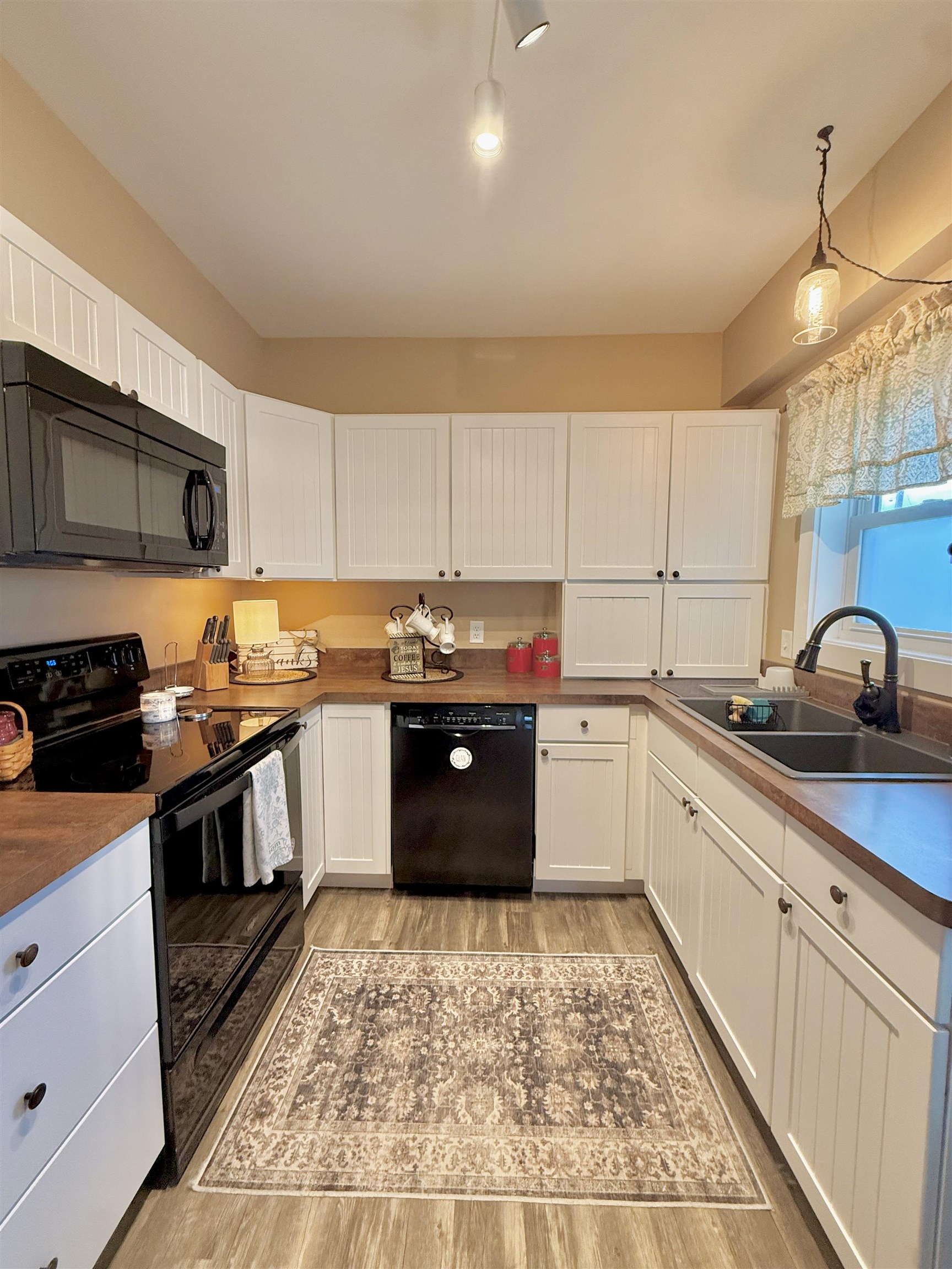 15385 Evergreen Valley Road Timberville, VA 22853 - Photo 7 of 44 a kitchen with granite countertop wooden cabinets and stainless steel appliances