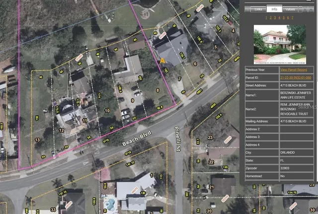 a view of a lake with boats and trees in the background