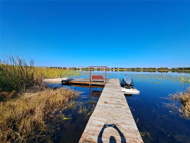 a view of a lake with a yard