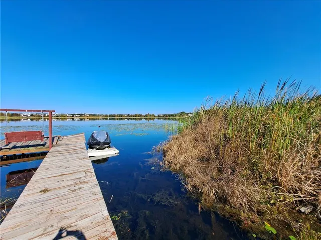 a view of a balcony with wooden floor and outdoor space
