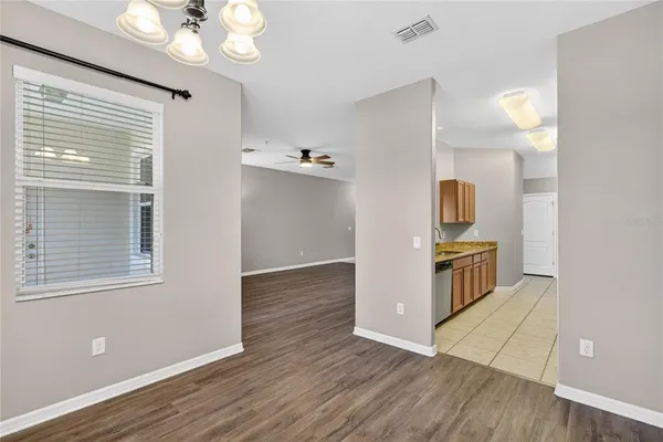 a view of kitchen with furniture and wooden floor
