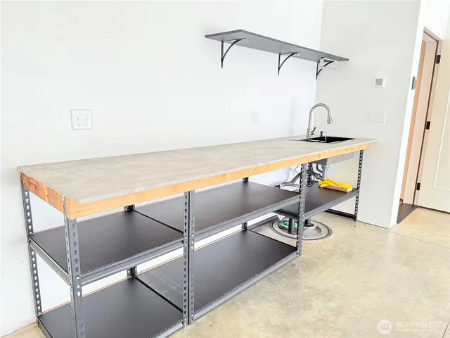 a bathroom with a sink and a shower