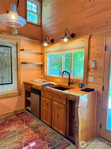 a utility room with sink dryer and washer