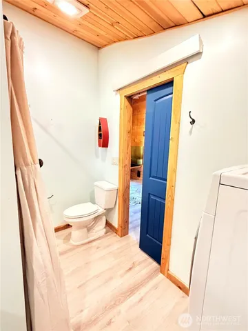 a view of a backyard with a table and chairs