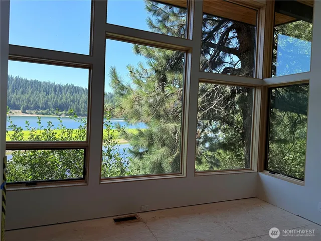 a view of a room with floor to ceiling windows