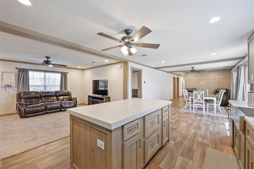 626 Epps Road Palmer, TX 75152 - Photo 19 of 27 Spacious open-concept interior featuring light wood-finish flooring, recessed lighting, and ceiling fans