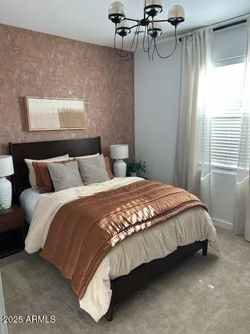 a bedroom with a bed and window