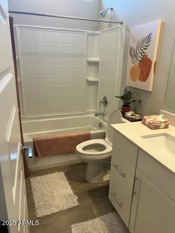 a bathroom with a toilet a sink and bathtub