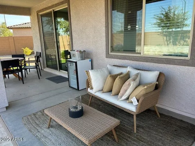 a living room with furniture and a window