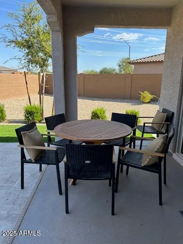 a view of an outdoor sitting area with furniture