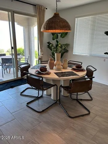 a view of a livingroom with furniture and a table