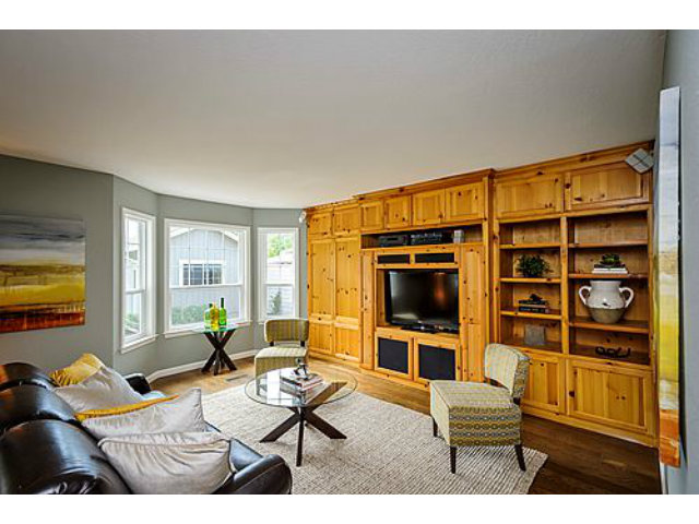 113 Channing Road Burlingame, CA 94010 - Photo 13 of 25 a living room with furniture a flat screen tv and next to a window