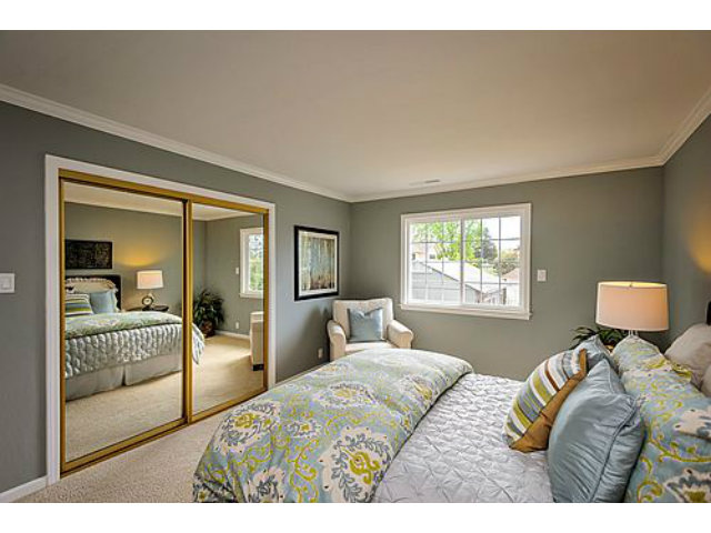 113 Channing Road Burlingame, CA 94010 - Photo 17 of 25 a bedroom with a bed and wooden floor