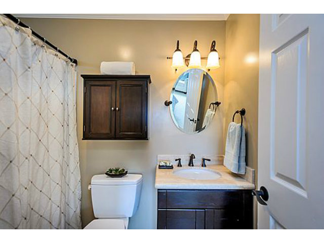 113 Channing Road Burlingame, CA 94010 - Photo 18 of 25 a bathroom with a sink and a mirror