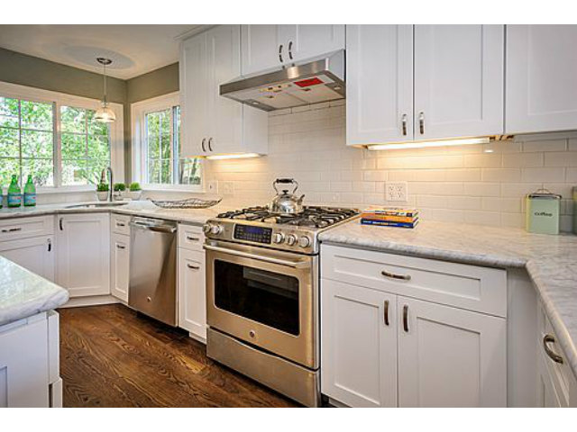 113 Channing Road Burlingame, CA 94010 - Photo 7 of 25 a kitchen with stainless steel appliances white cabinets and a stove a sink