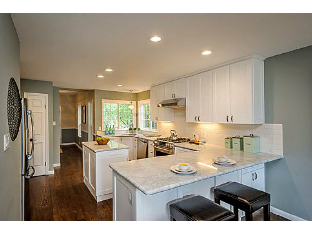 113 Channing Road Burlingame, CA 94010 - Photo 8 of 25 a kitchen with a sink a stove a refrigerator and cabinets