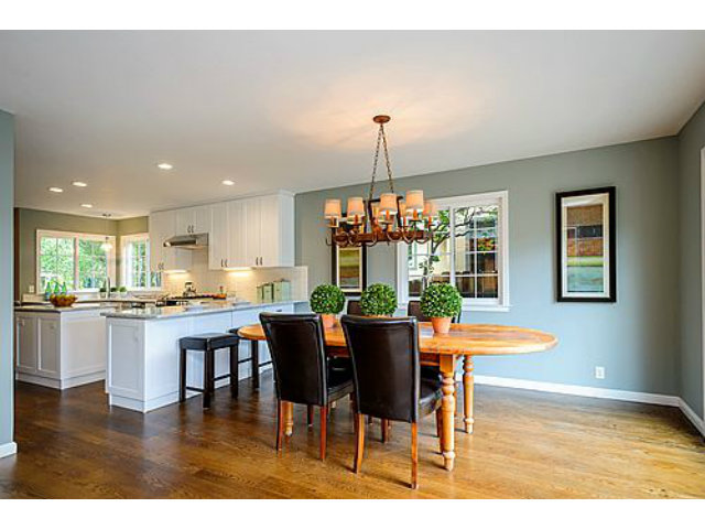 113 Channing Road Burlingame, CA 94010 - Photo 10 of 25 a dining room with wooden floor a chandelier a glass table and chairs