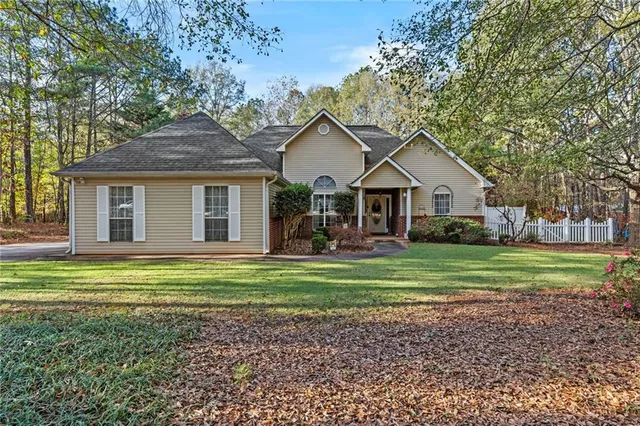 a front view of a house with a yard and porch