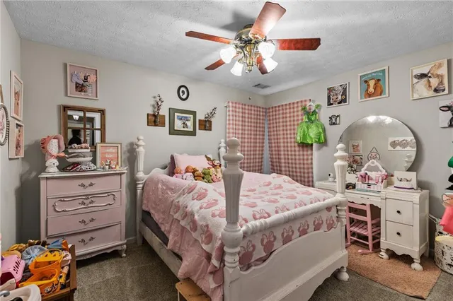 a bed room with bed and window