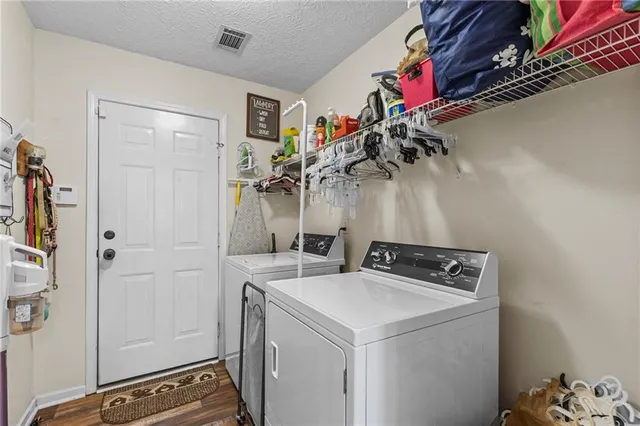 a view of storage and utility room with closet