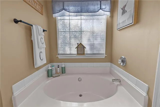 a bathroom with shower and bathtub