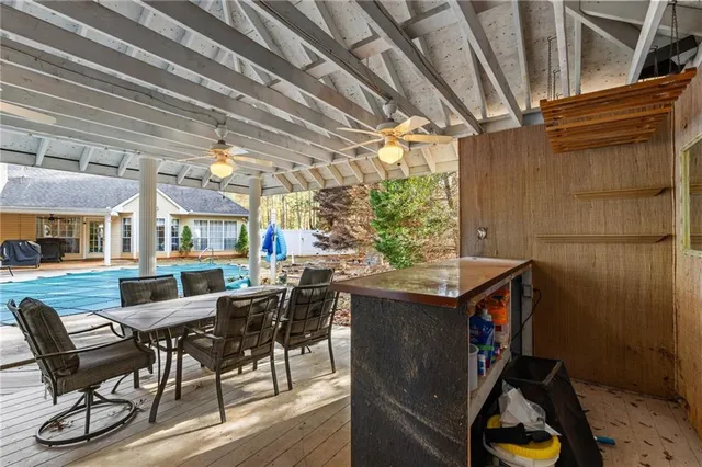 a view of a dining room with furniture window and outside view
