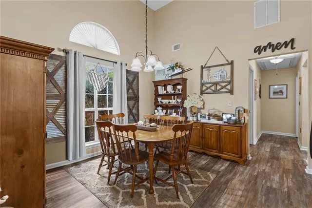 a view of a dining room with furniture and window