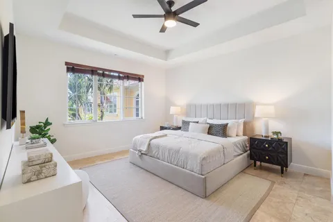 a bedroom with a bed and a couch