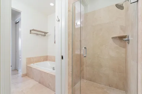 a bathroom with a bathtub and shower