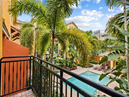 a view of a balcony with a tree