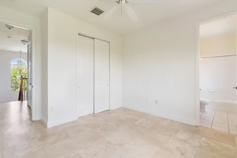 a living room with furniture a rug and a window