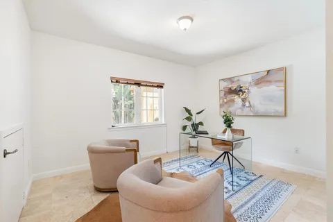 a bathroom with a sink a mirror a toilet and shower