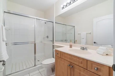 an aerial view of a house with a yard and sitting area