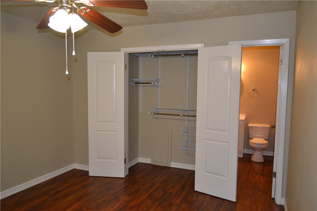 4212 Old College Road, Unit 7 Bryan, TX 77801 - Photo 12 of 19 a view of a room with wooden floor and a bathroom