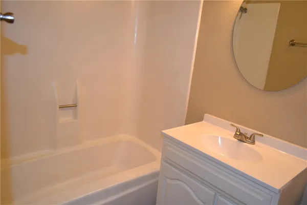 a bathroom with a sink and a bathtub
