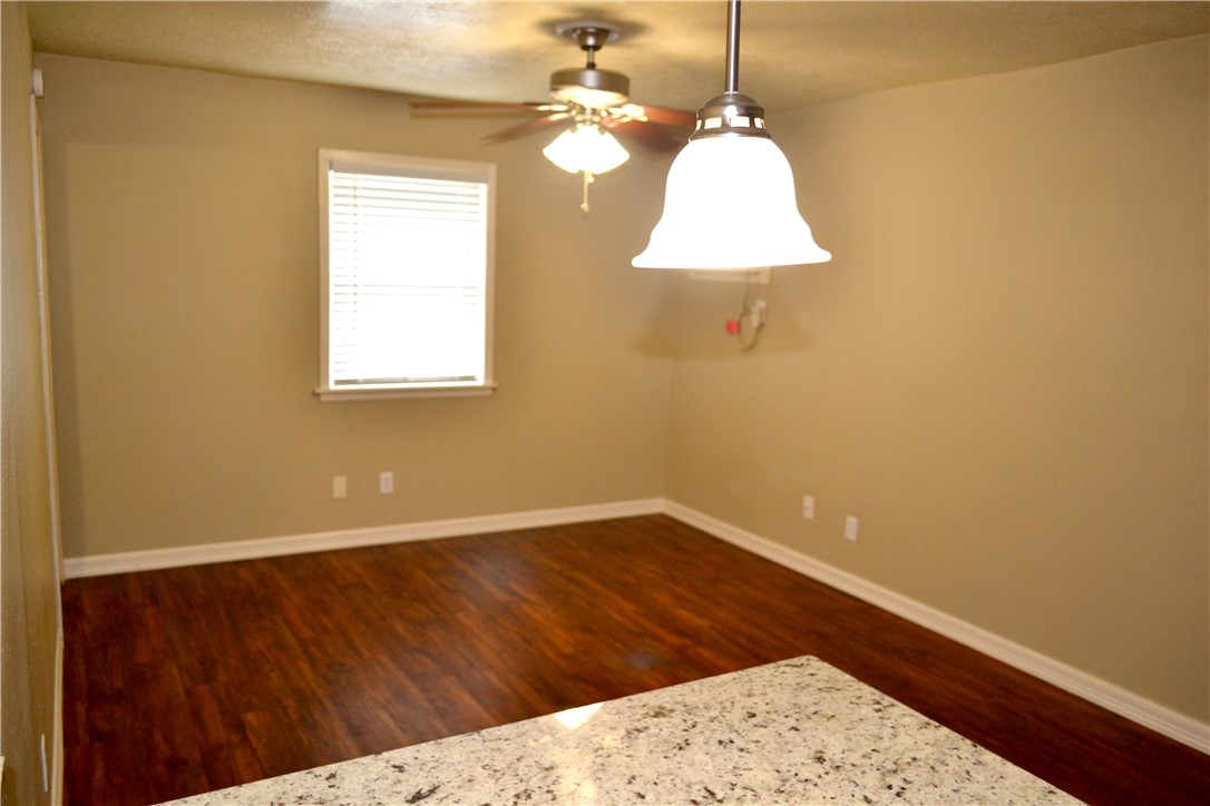 4212 Old College Road, Unit 7 Bryan, TX 77801 - Photo 8 of 19 a view of a room with a window and wooden floor
