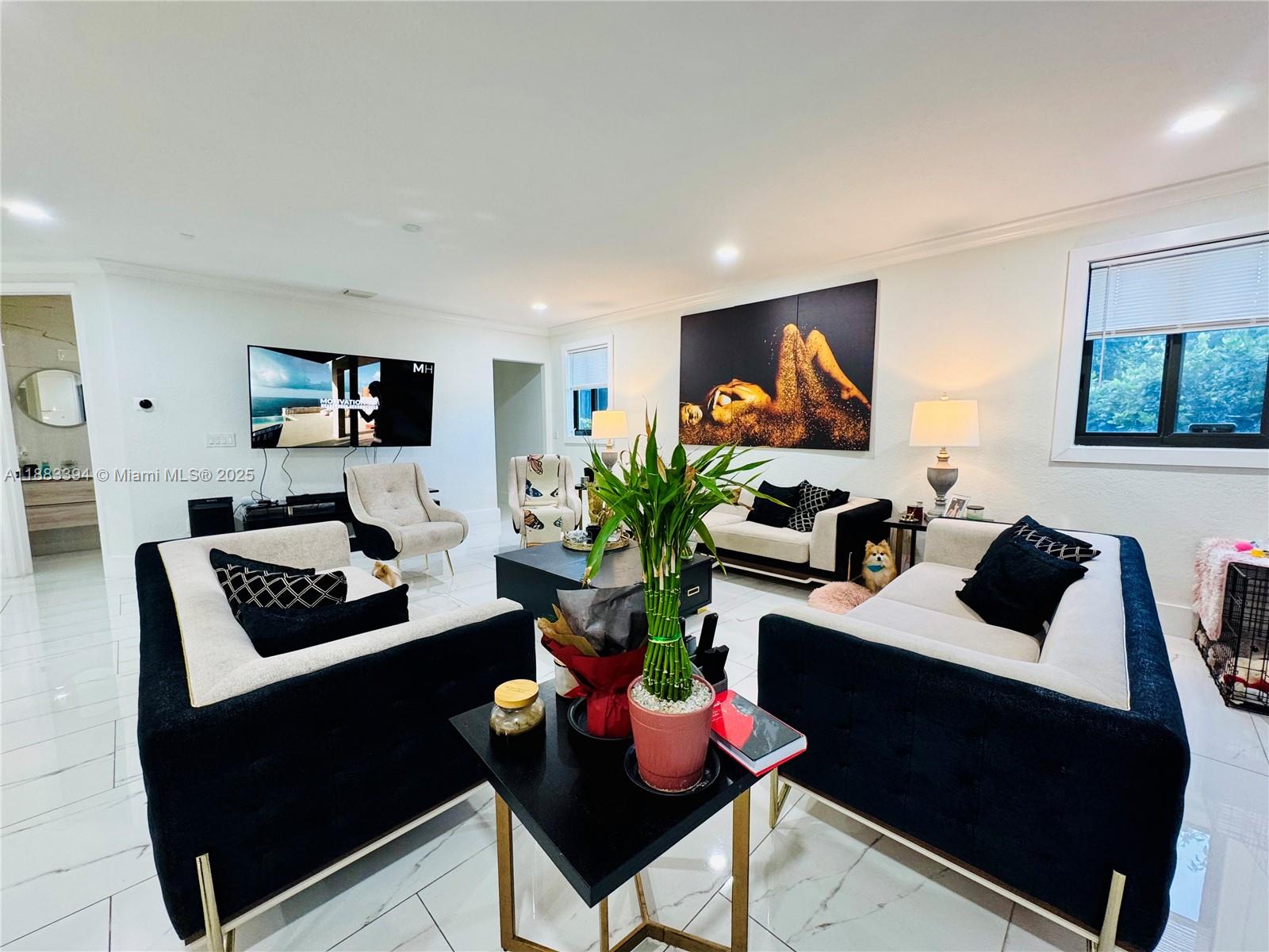 7408 Southwest 189th Street Cutler Bay, FL 33157 - Photo 12 of 25 a living room with furniture and a flat screen tv