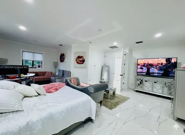 a living room with furniture a rug and a window