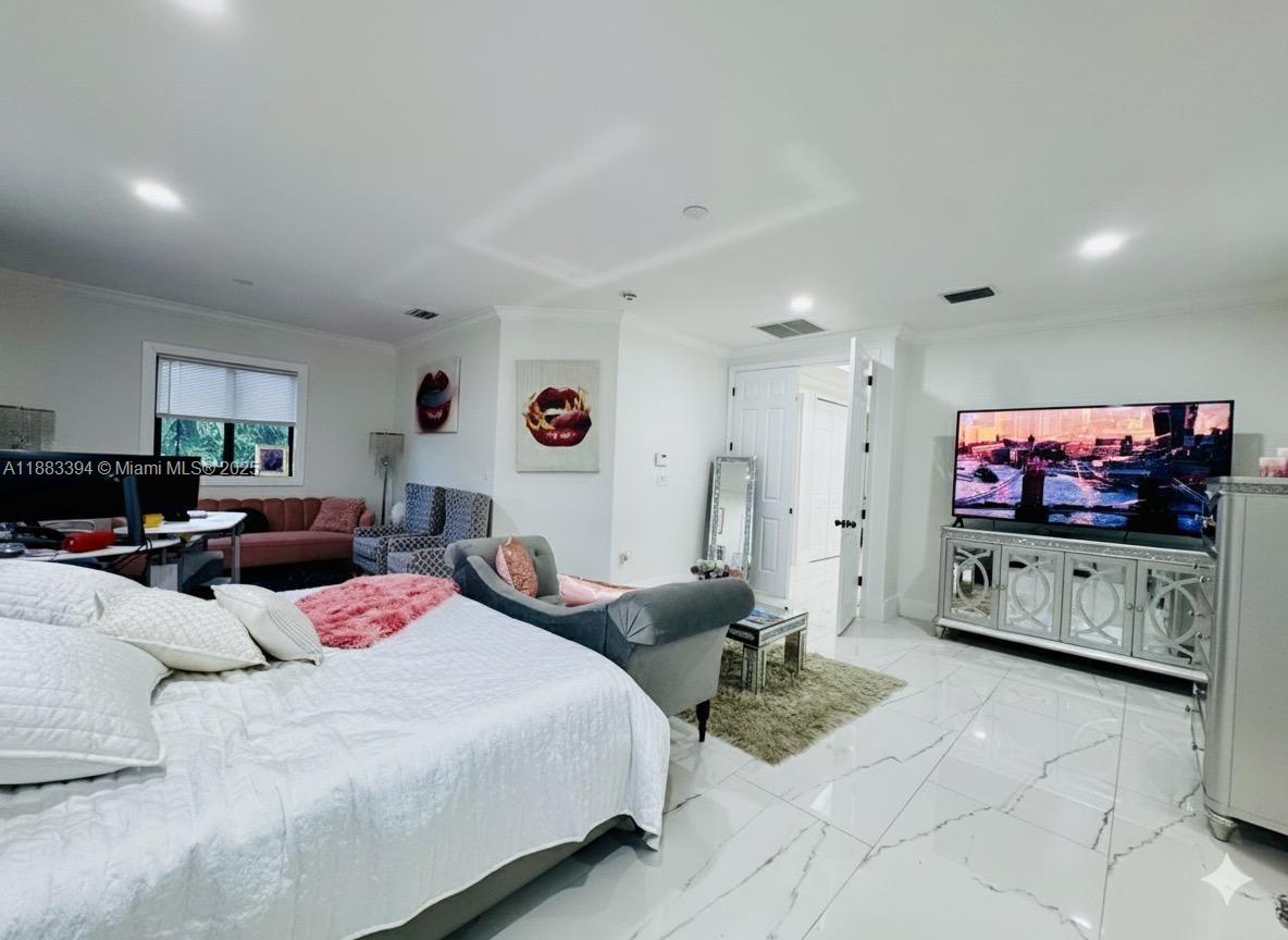 7408 Southwest 189th Street Cutler Bay, FL 33157 - Photo 16 of 25 a living room with furniture and a flat screen tv