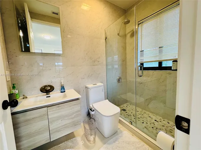 a bedroom with a bed and a walk in closet