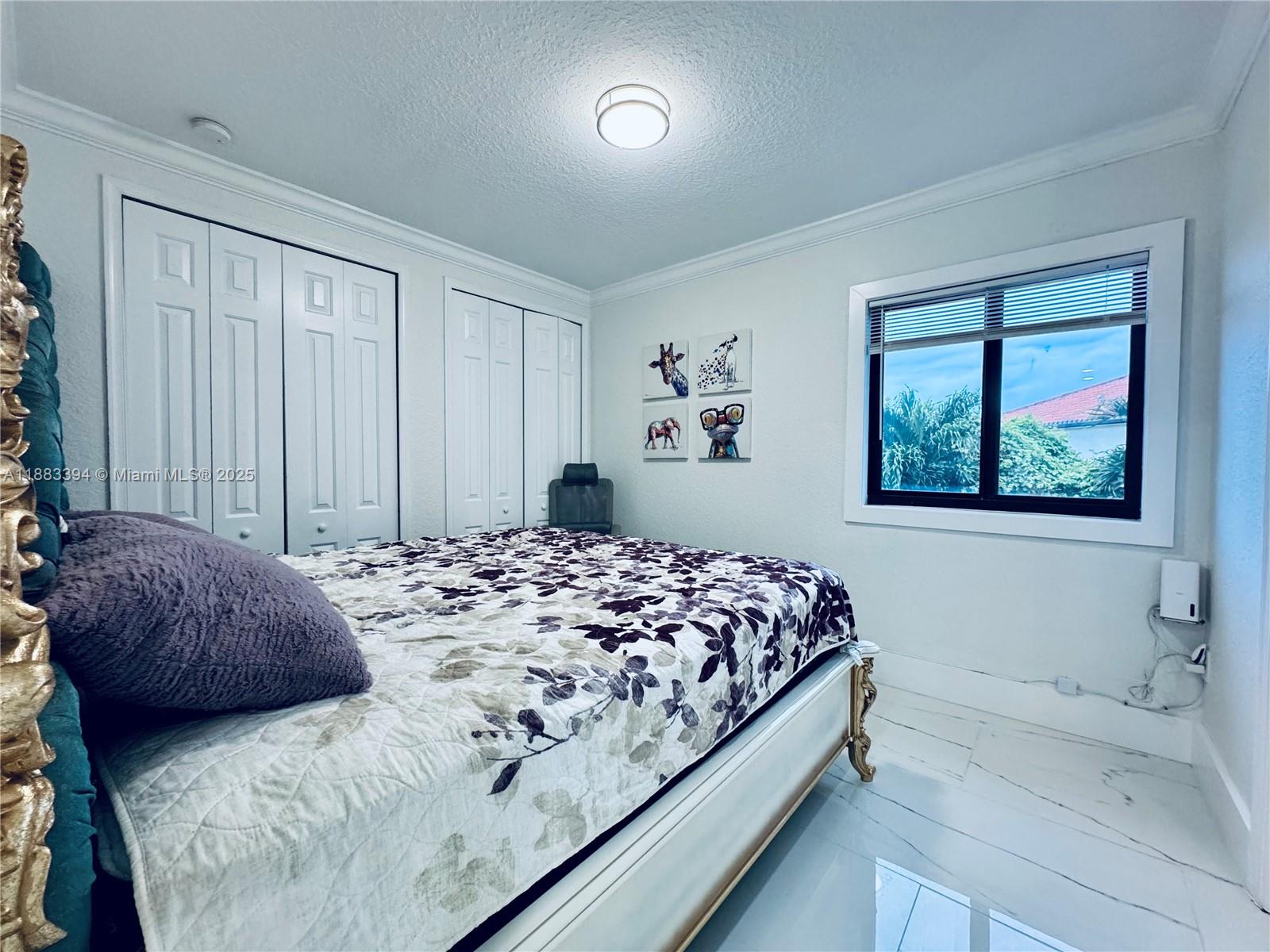 7408 Southwest 189th Street Cutler Bay, FL 33157 - Photo 22 of 25 a bedroom with a bed and a window