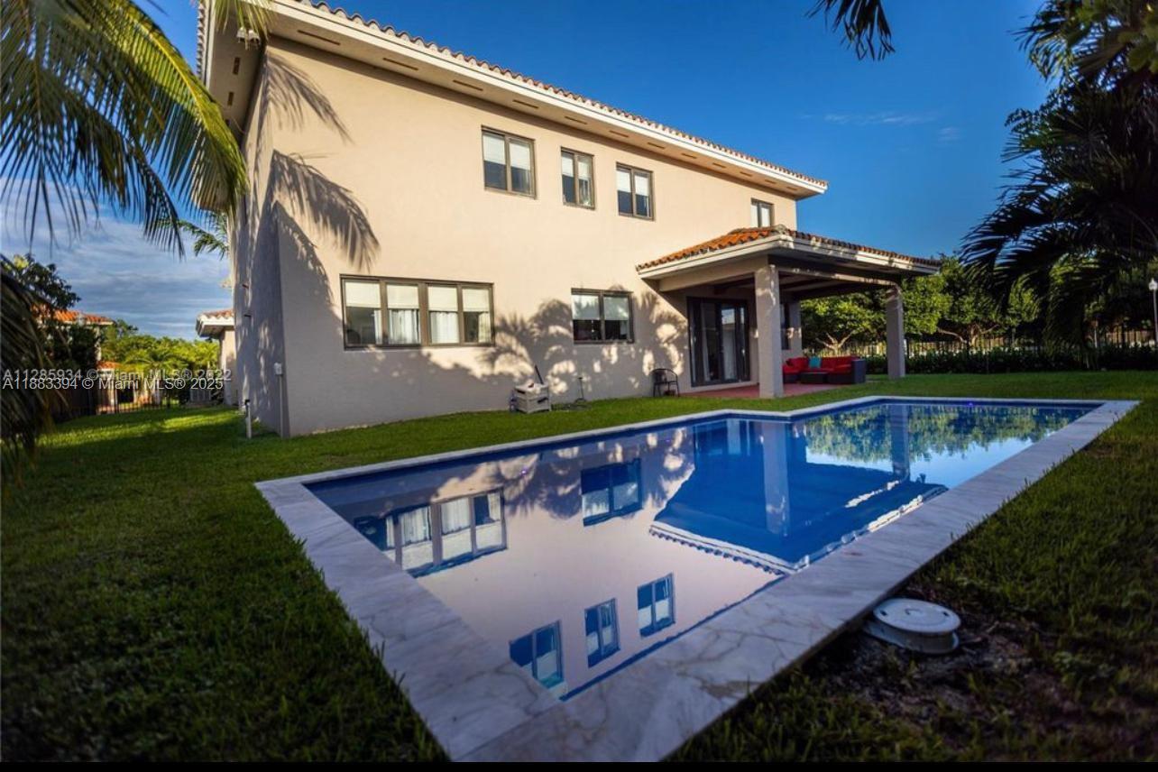 7408 Southwest 189th Street Cutler Bay, FL 33157 - Photo 23 of 25 a view of a house with a yard from a balcony