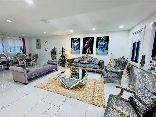 a living room with furniture gym equipment and a window