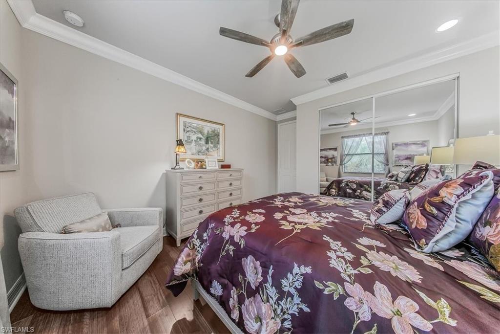 4616 Azalea Drive Naples, FL 34119 - Photo 12 of 44 Bedroom with crown molding, wood finished floors, a ceiling fan, a closet, and recessed lighting